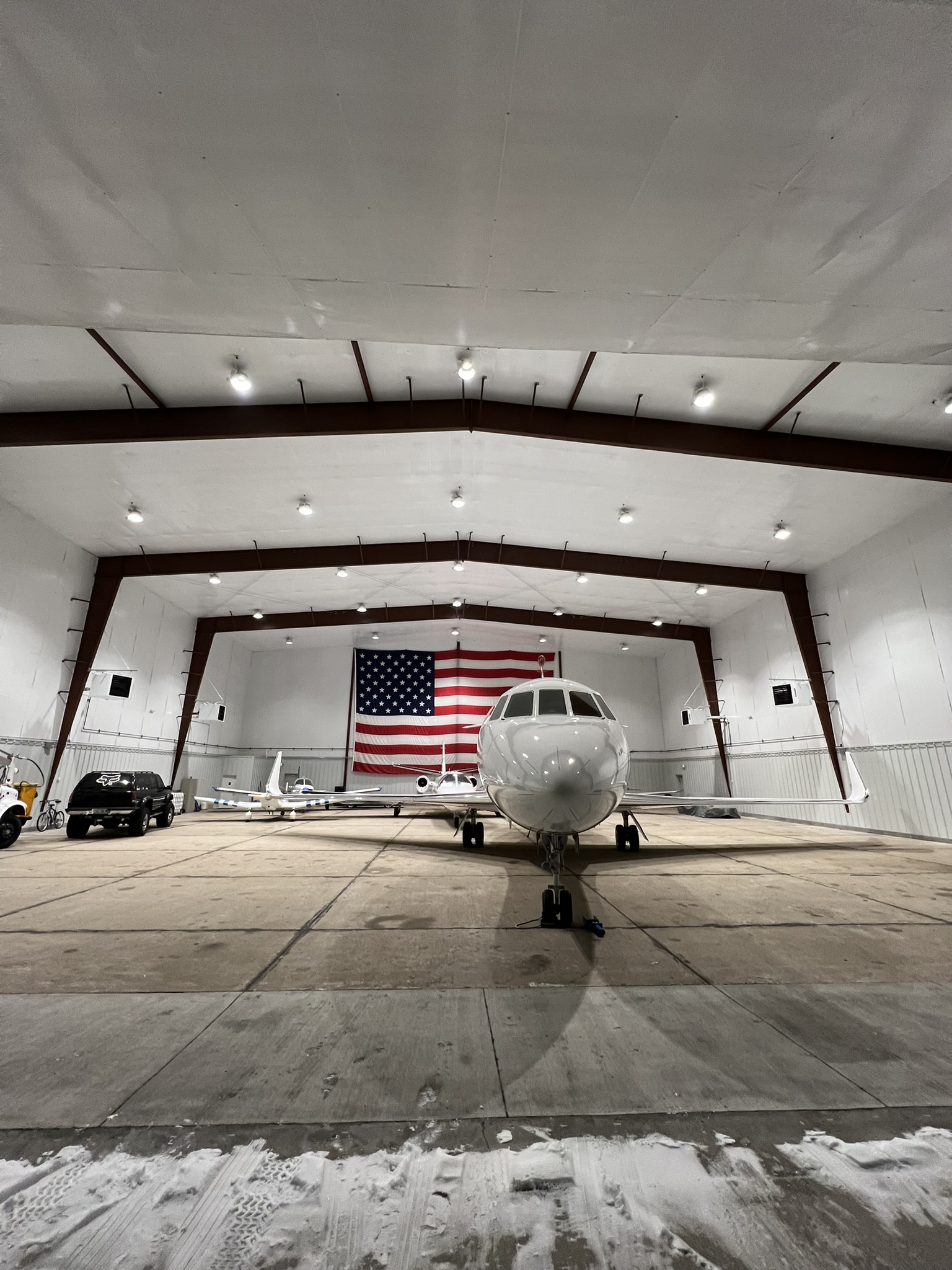 Aircraft inside heated hangar facility